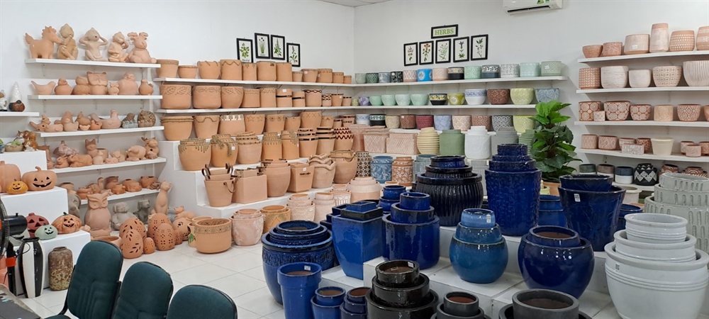 Blue glazed pots and terracotta in the showroom