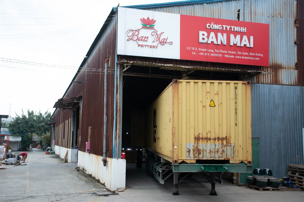 Ban Mai warehouse entrance with a container being loaded
